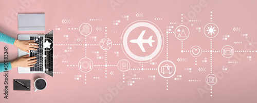 Airplane travel theme with person using a laptop
