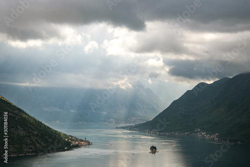 Kotor bay with ight shining through to light up the old town of kotor