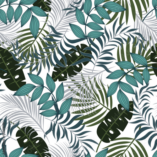 Abstract seamless tropical pattern with bright blue and green plants and leaves on white background. Beautiful exotic plants. Seamless pattern with colorful leaves and plants.