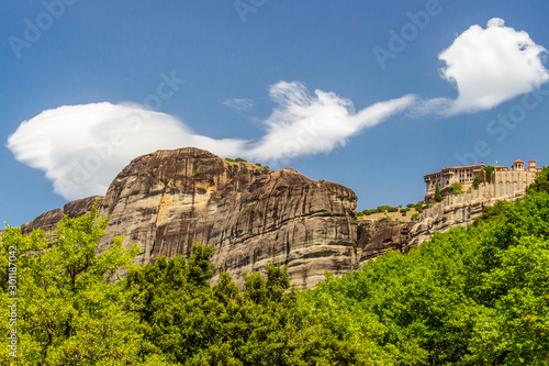 Scenic view of Meteora Valley with rock formations and the Holy Monastery of Varlaam, part of the Eastern Orthodox monastery complex of Meteora, Central Greece