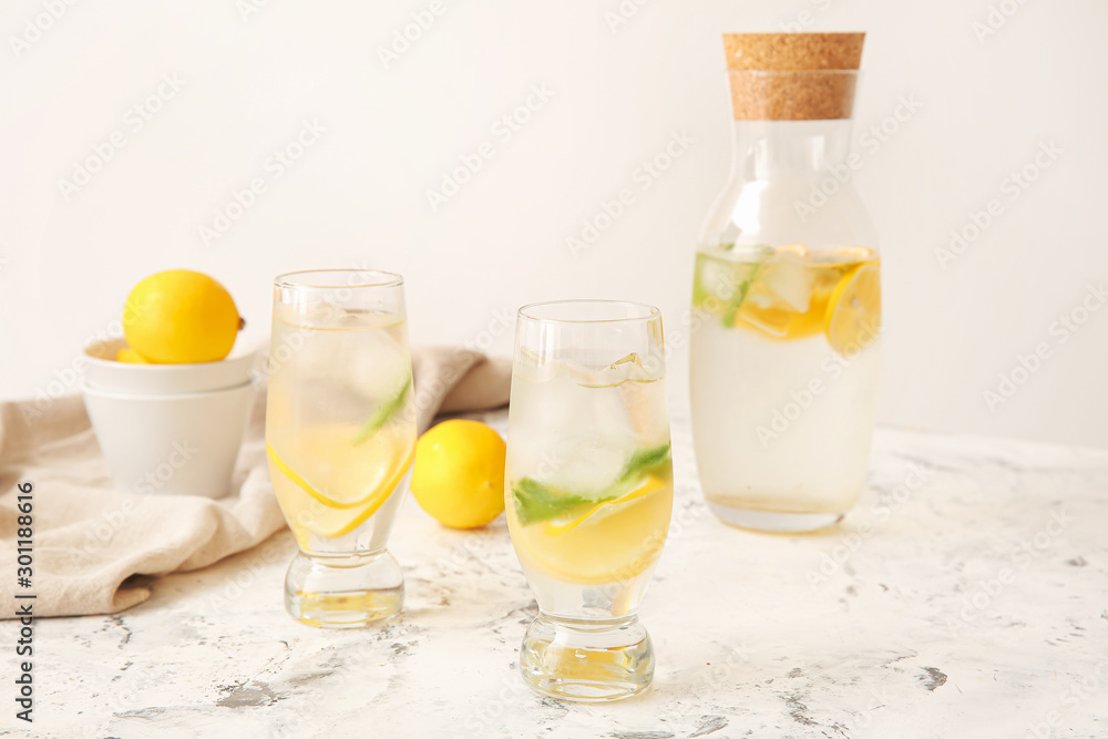 Tasty fresh lemonade on white table Tasty fresh lemonade on white table