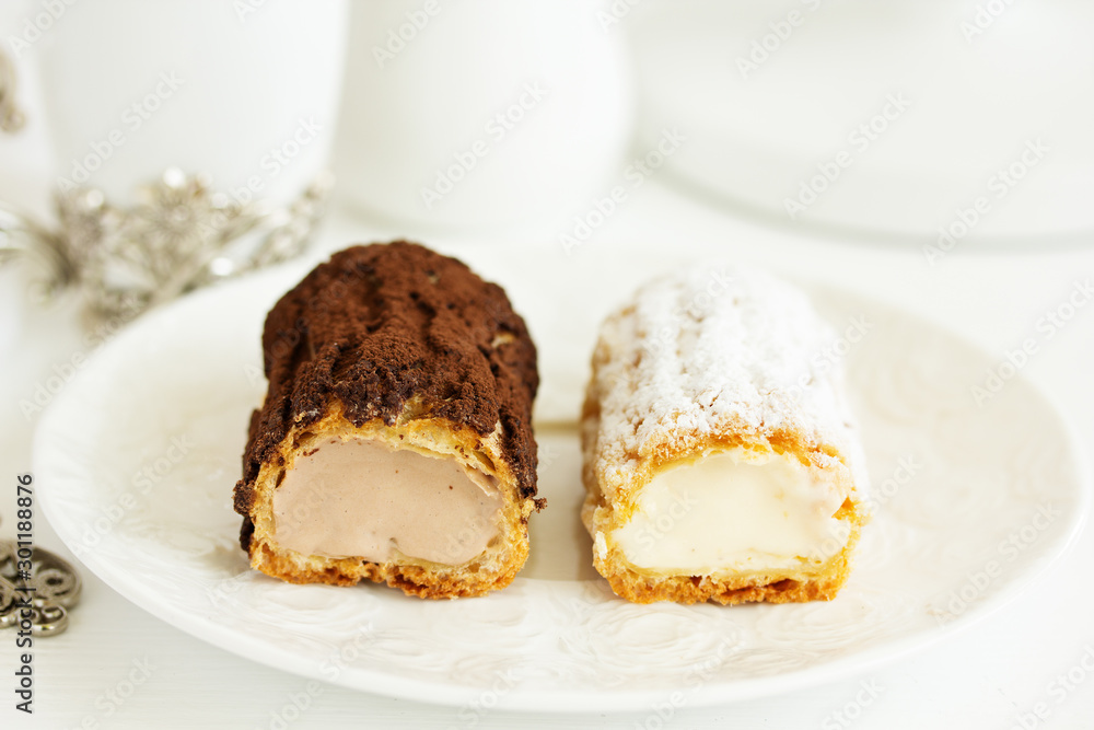 Sectional homemade eclairs, chocolate and vanilla. Sectional homemade eclairs, chocolate and vanilla.