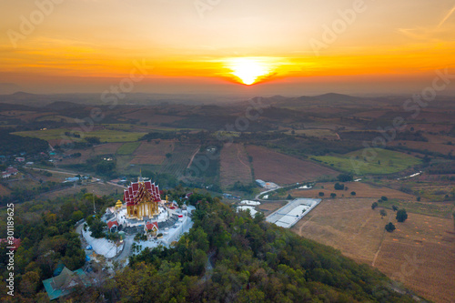 Top view Aerial photo from flying drone.The beautiful of Thai temple (Wat Pa Phu Hai Long) on the top of mountain in Pak Chong District,Nakorn Ratchasima, Thailand.
