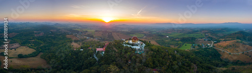 Top view Aerial photo from flying drone.The beautiful of Thai temple (Wat Pa Phu Hai Long) on the top of mountain in Pak Chong District,Nakorn Ratchasima, Thailand.