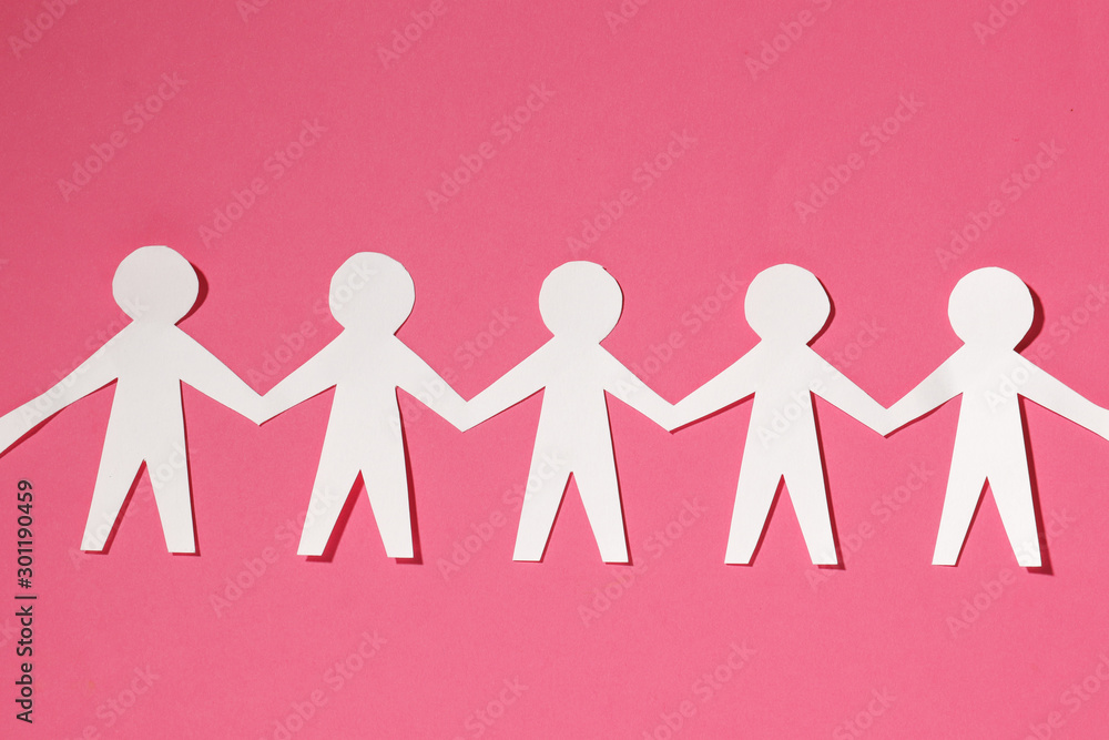 Paper cut Style concept of a leader and relationship with friendship and hand-holding of people in symbolic form on Inspiration style and modern pink paste background - 3D rendering Paper cut Style concept of a leader and relationship with friendship and hand-holding of people in symbolic form on Inspiration style and modern pink paste background - 3D rendering