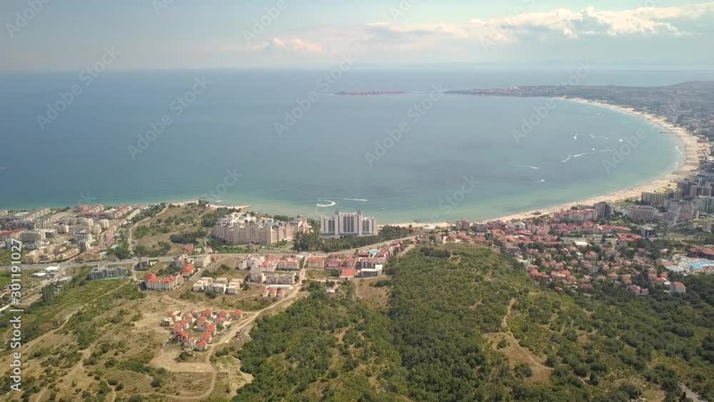 Aerial view of Sunny Beach city that is located on Black Sea shore. Top view of sand beaches with many hotel buildings and tourist infrastructure. Aerial view of Sunny Beach city that is located on Black Sea shore. Top view of sand beaches with many hotel buildings and tourist infrastructure.