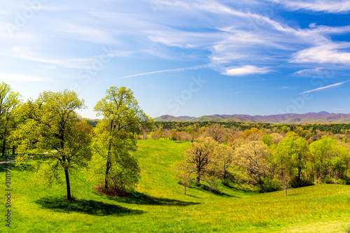 Beautiful rolling hills and the distant Blue Ridge Mountains can be seen in early spring near Asheville, NC, a premier tourist destination in the Southern United States.