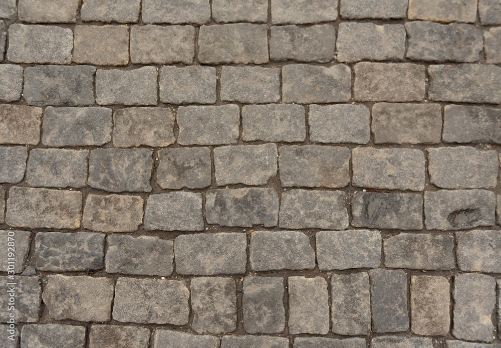 Stone paving texture. The pavement of the Red Square in Moscow. Abstract structured background. Stone paving texture. The pavement of the Red Square in Moscow. Abstract structured background.