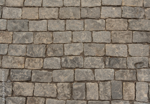 Stone paving texture. The pavement of the Red Square in Moscow. Abstract structured background.