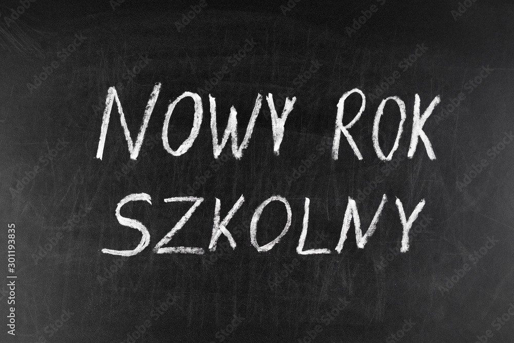 Colorful chalk drawing on a chalkboard: Polish text A New School Year Colorful chalk drawing on a chalkboard: Polish text A New School Year
