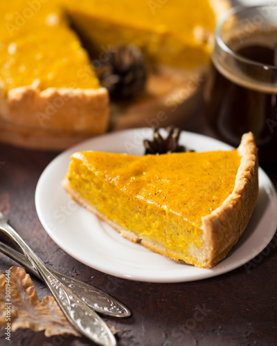 Traditional American thanksgiving pumpkin pie and coffee mug