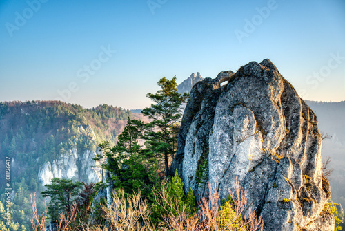 rock in autumn with fallen leaves on the ground, slovakia, sulovske rocks
