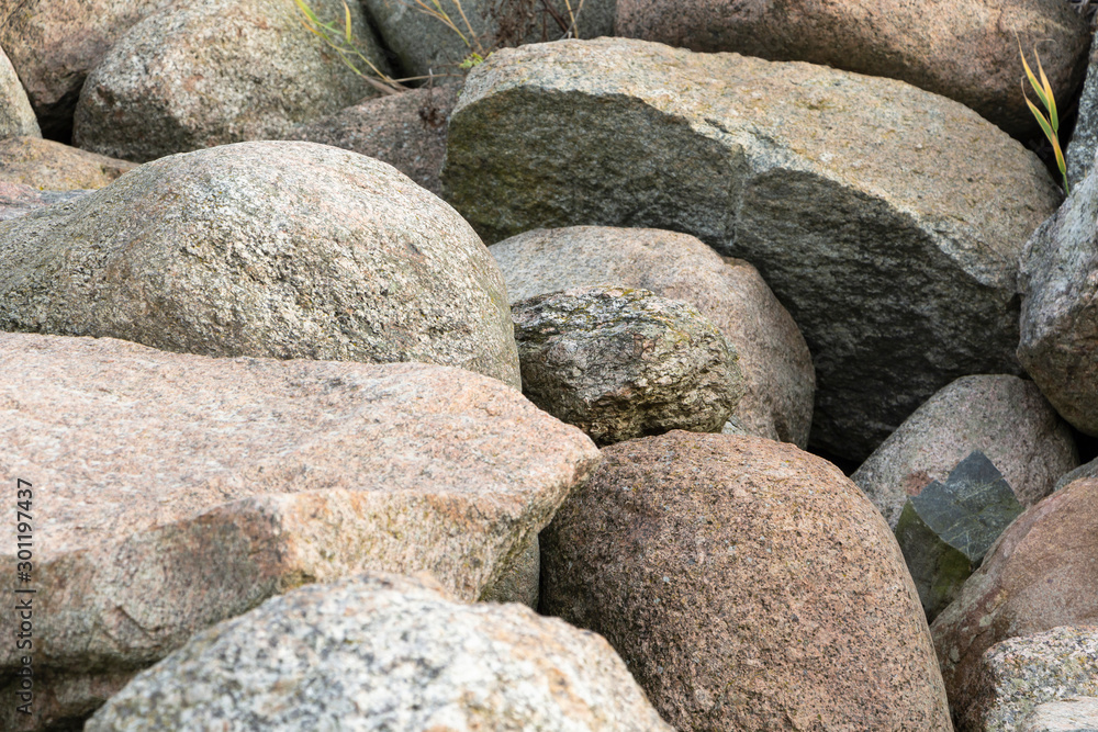 A pile of large gray stones. Many gray stones. The collapse of the stones.
