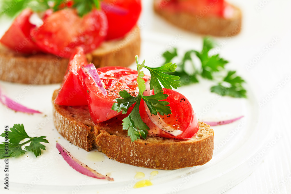 Bruschetta with tomatoes and onions. Selective focus Bruschetta with tomatoes and onions. Selective focus
