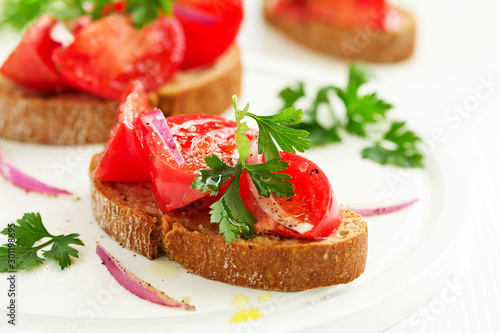 Bruschetta with tomatoes and onions. Selective focus