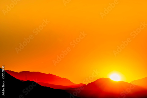 Orange Sunrise over Horizon of Mountains © Mark