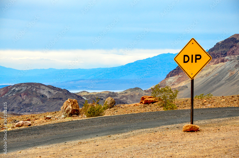 Dip in the road sign at Artist's Palette, Death Valley National Park, California, USA.