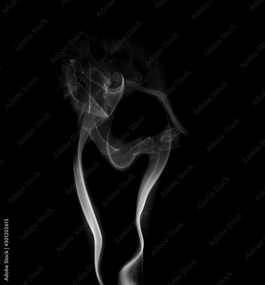 Obraz premium Movement of white smoke isolated on black background.Abstract shape and curve of smoke.