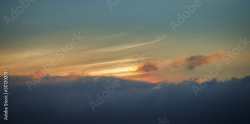 Setting Sun gilds the High Cirrus Clouds