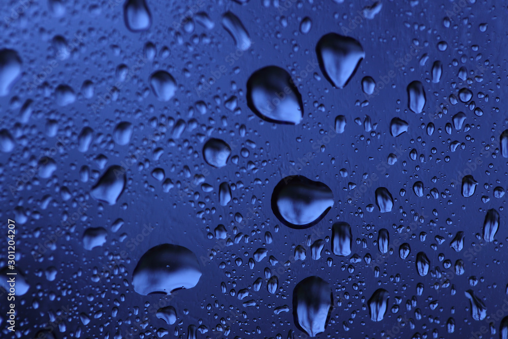 Water droplets that perch on the windshield of the car Water droplets that perch on the windshield of the car