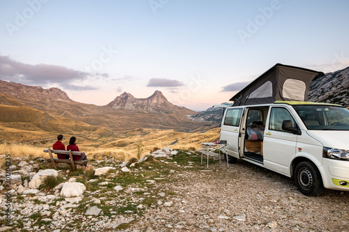 Fototapeta Freedom of a camper van exploring the mountains eating, cooking and cleaning loo
