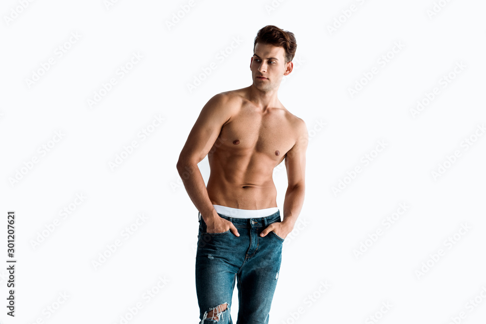 sexy man with hands in pockets isolated on white sexy man with hands in pockets isolated on white