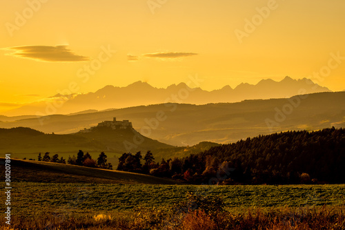 Obraz na płótnie Sunset over the Spis Castle in backround with wonderful scenery of High Tatras Mountains, Slovakia w salonie