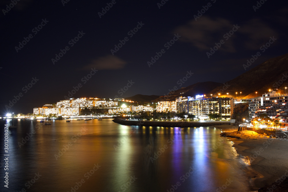 Night view from canary coast anfi beach in the south of gran canaria island.