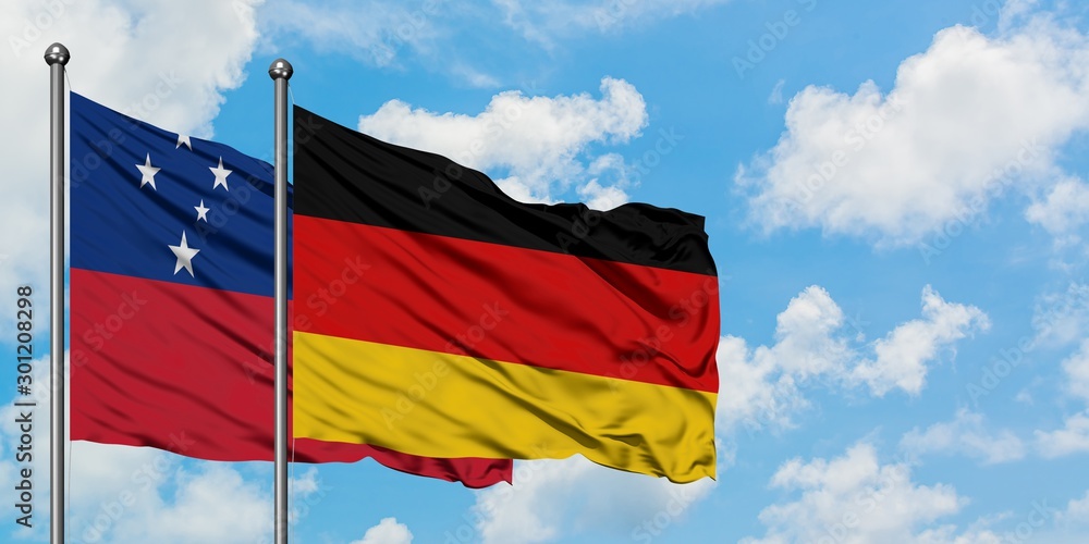 Samoa and Germany flag waving in the wind against white cloudy blue sky together. Diplomacy concept, international relations. Samoa and Germany flag waving in the wind against white cloudy blue sky together. Diplomacy concept, international relations.