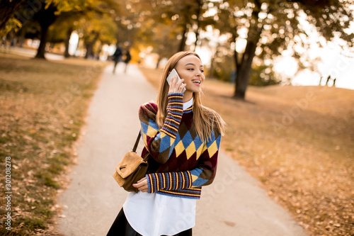 Pretty young woman walking ...