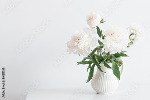 Fototapeta Naklejka Na Ścianę i Meble -  peonies flowers in vase on white background