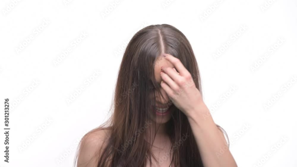 Gorgeous young woman with healthy long hair tossing hair and shaking head for hair motion isolated on white background. Gorgeous young woman with healthy long hair tossing hair and shaking head for hair motion isolated on white background.