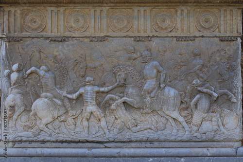 Historical motifs of on the exterior wall of Charles V Palace at Alhambra Palace complex in Granada, Andalusia, Spain.