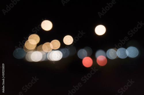 Bokeh lights on the city streets © Pattabodee