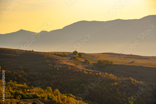 Morning autumn landscape.Silhouette of mountains against the dawn sky.