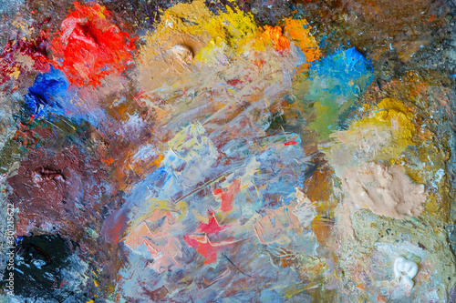 Close-up photo of a palette with oil paints