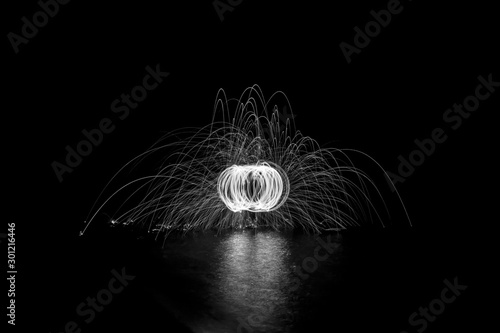 Wire Wool Spinning in the Dark on a Lake in Black and White