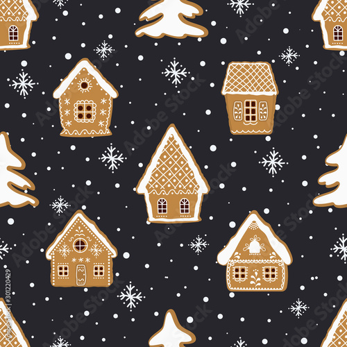 Christmas background. Seamless winter pattern. Gingerbread village. There are gingerbread houses and fir trees on a dark blue background. Greeting card template. Vector