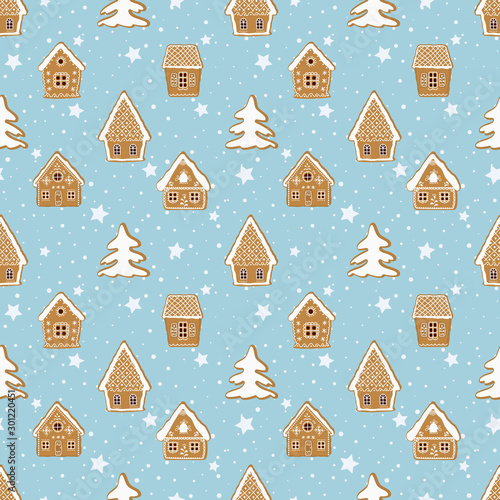 Christmas background. Seamless winter pattern. Gingerbread village. There are gingerbread houses and fir trees on a blue background. Greeting card template. Vector