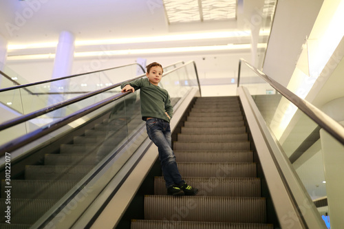Child moves on escalator