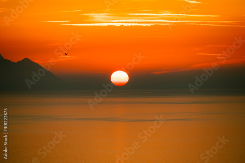 Fototapeta Naklejka Na Ścianę i Meble -  Sunset in kushadasi turkey with a view of greece mountains