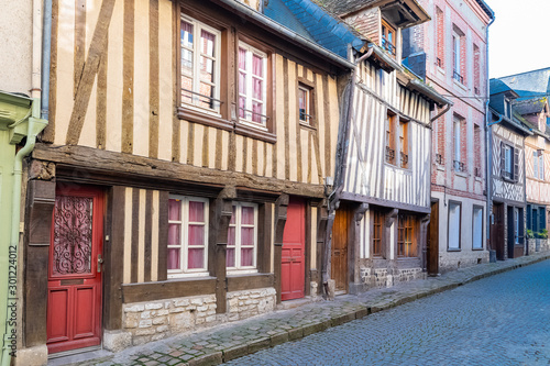 Canvas Print Honfleur in Normandy, typical street with half-timbered houses