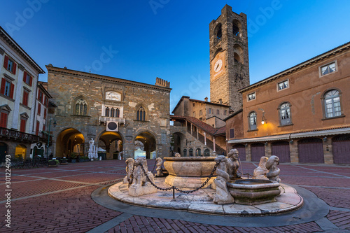 Beautiful architecture of the Piazza Vecchia in Bergamo at dawn, Italy