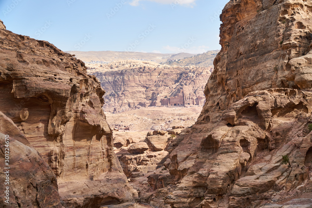 Royal Tombs in ancient city of Petra seen from rocky canyon, Jordan 