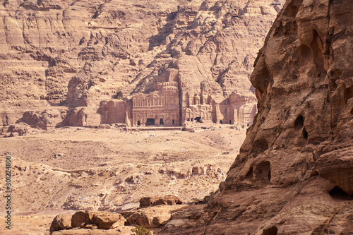 Royal Tombs in ancient city of Petra seen from rocky canyon, Jordan 