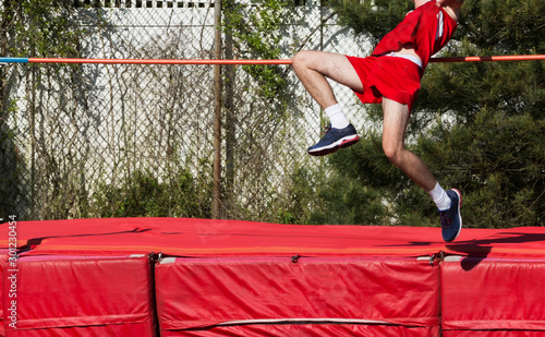 Boy high jumping outdoors