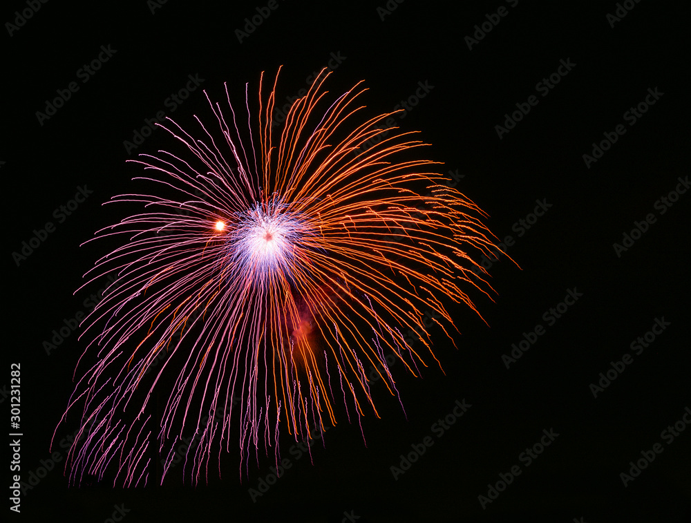 Violet fireworks isolated in dark background close up with the place for text Violet fireworks isolated in dark background close up with the place for text