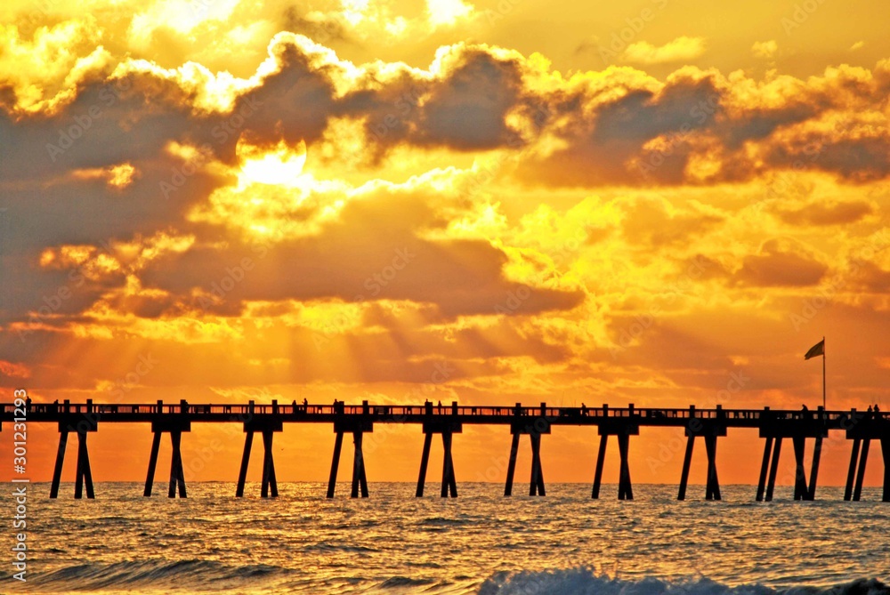 Golden sunrise at the pier