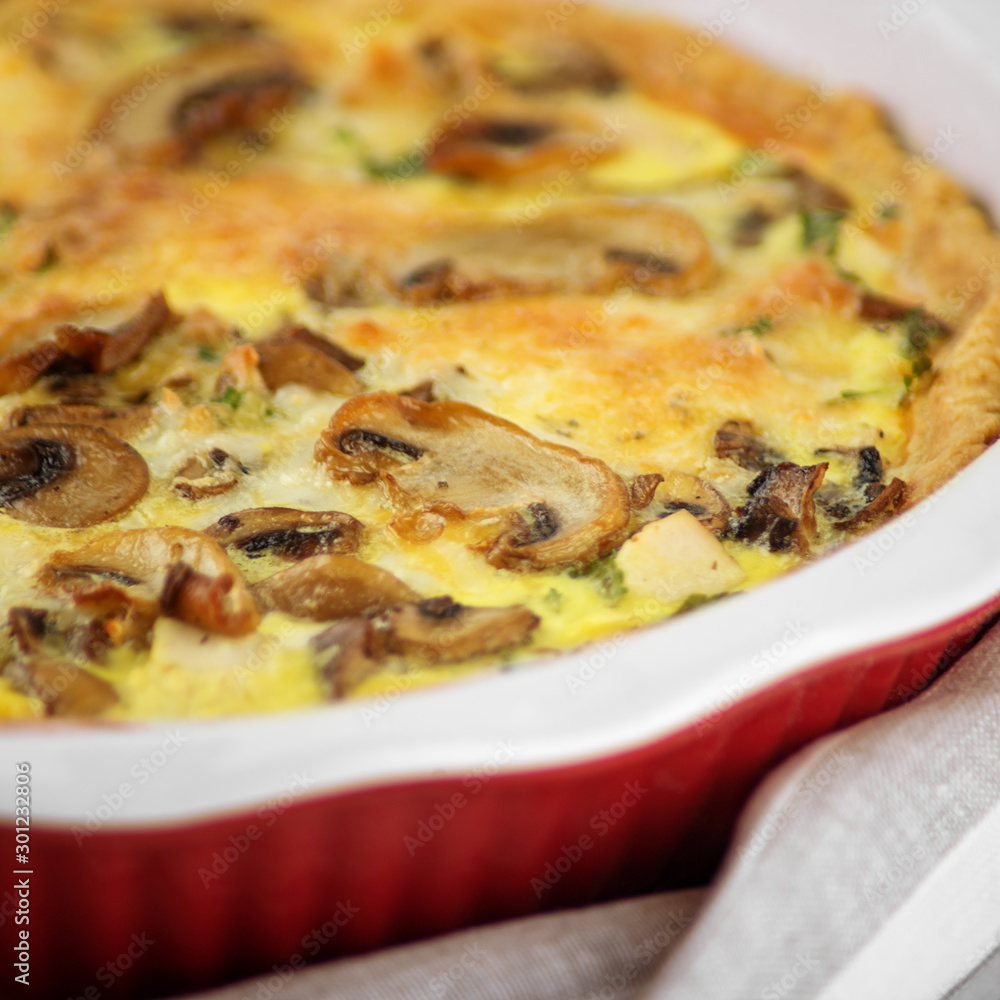 Quiche pie with chicken and mushrooms. The concept of food, breakfast, restaurant. Quiche pie with chicken and mushrooms. The concept of food, breakfast, restaurant.