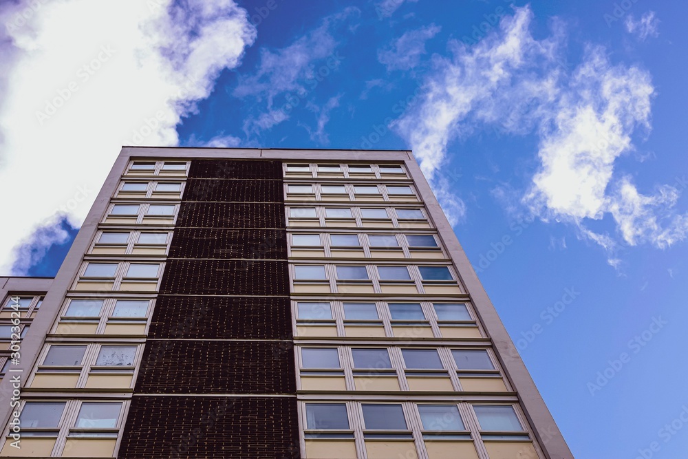 modern building with blue sky and clouds modern building with blue sky and clouds